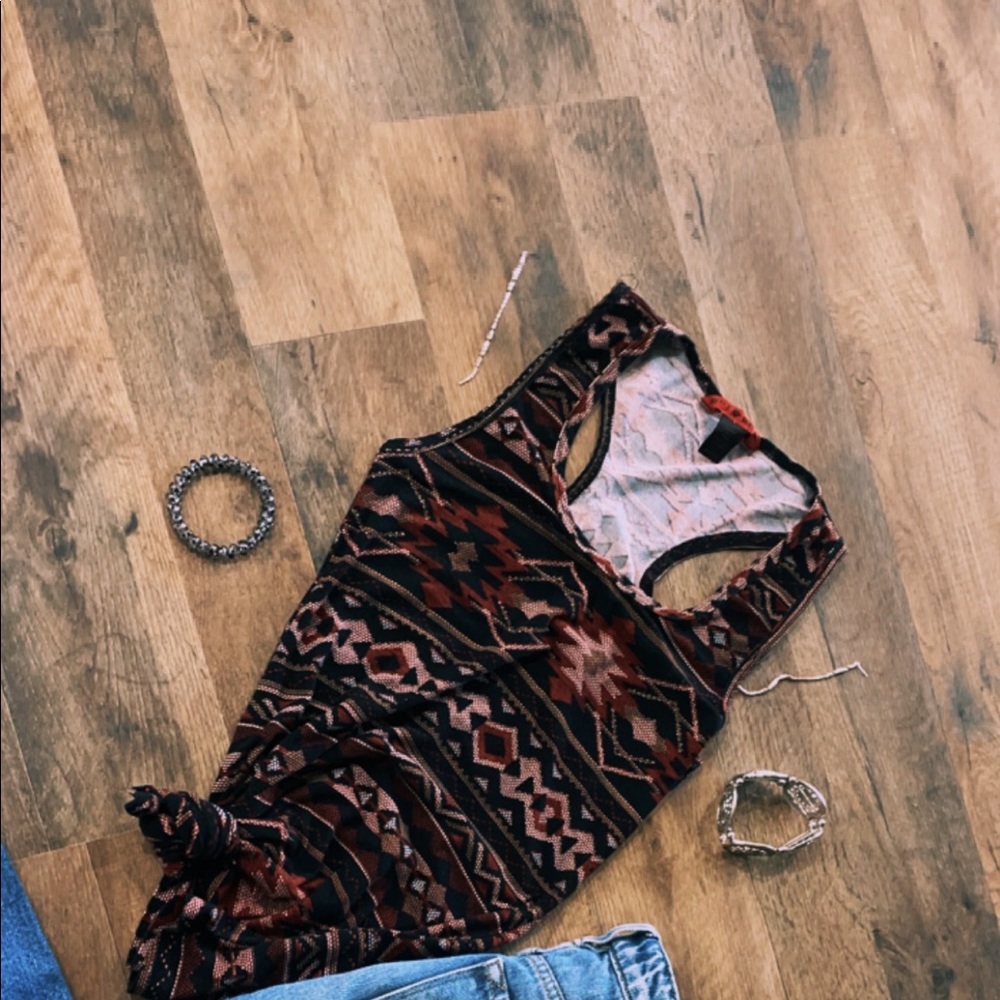 red, black, brown aztec top.